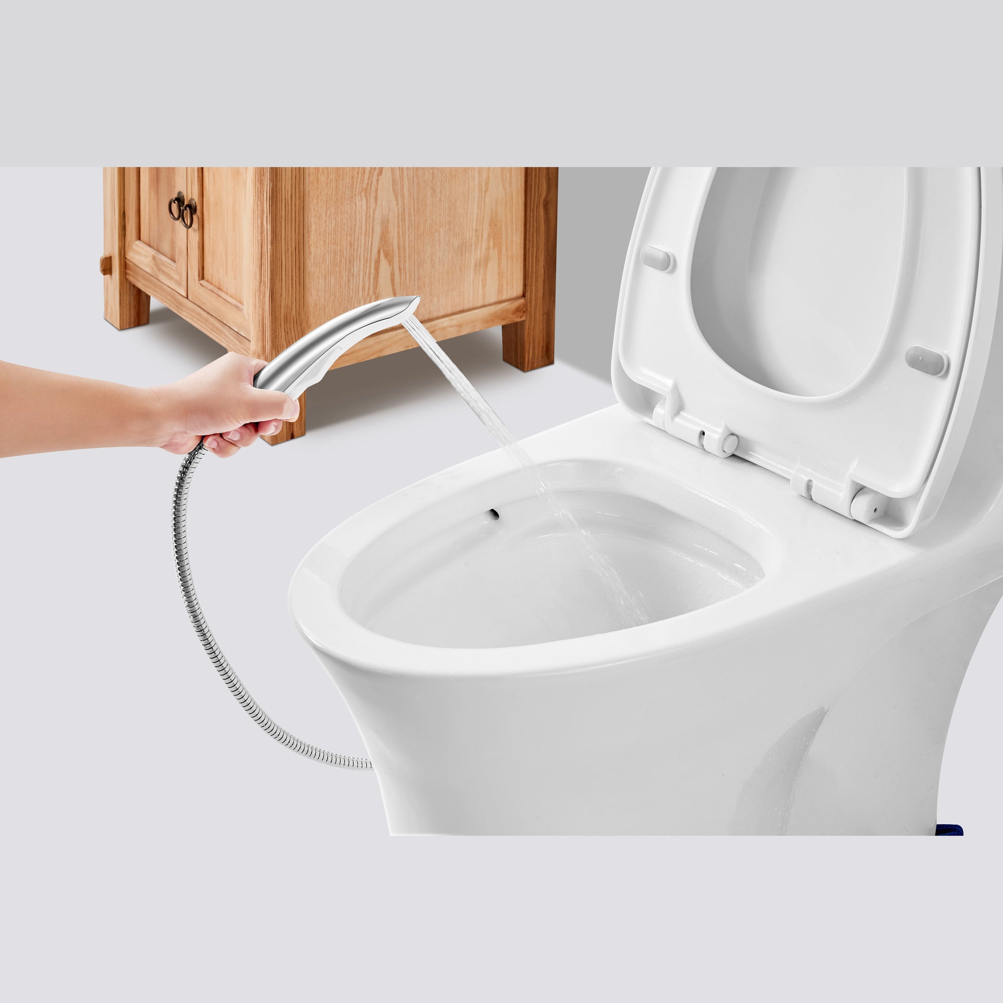 Tête de pommeau de douchette WC en utilisation au-dessus d'une cuvette